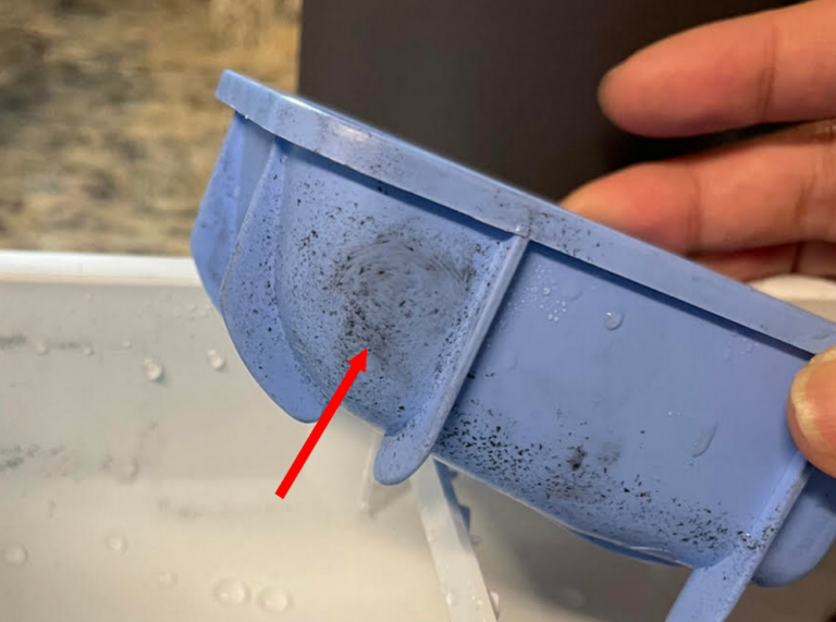 Black flakes in washing machine