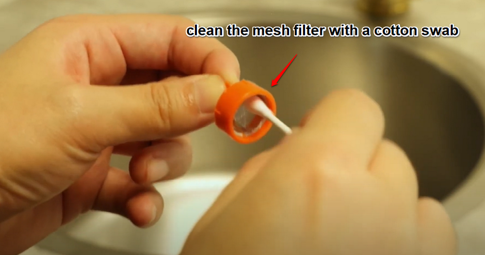 Clean the Mesh Filter with a Cotton Swab
