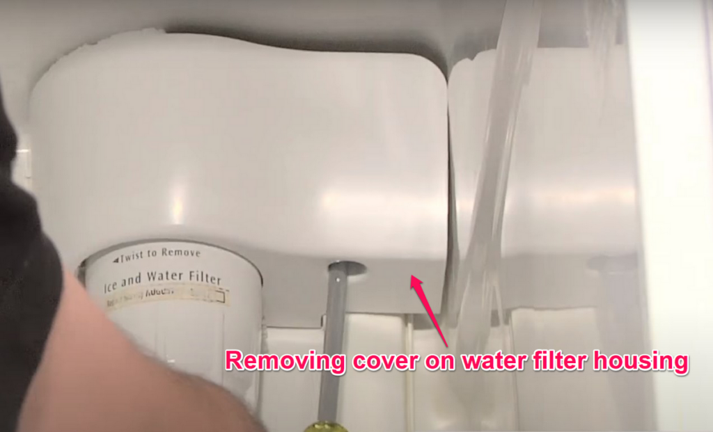 Removing cover on water filter housing