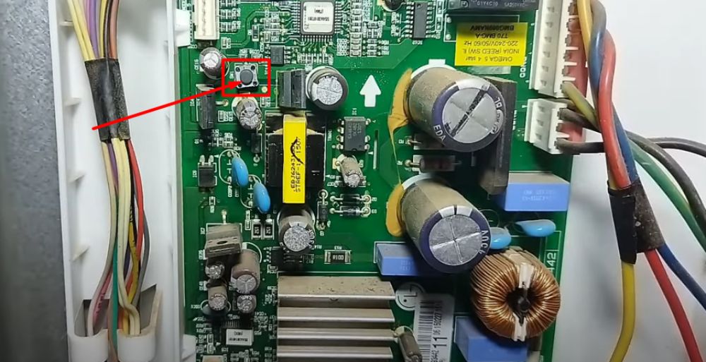 A fridge motherboard with a reset button