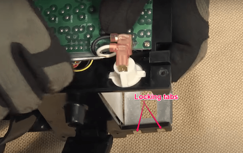 Removing Locking Tabs on the Assembly Dispenser Fridge